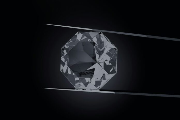 Photo by Akhilesh Sharma a black and white photo of a diamond