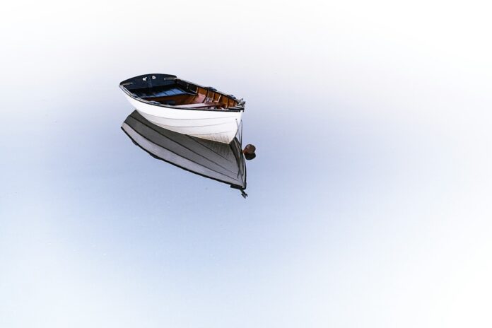 Photo by Osman Rana white boat on body of water