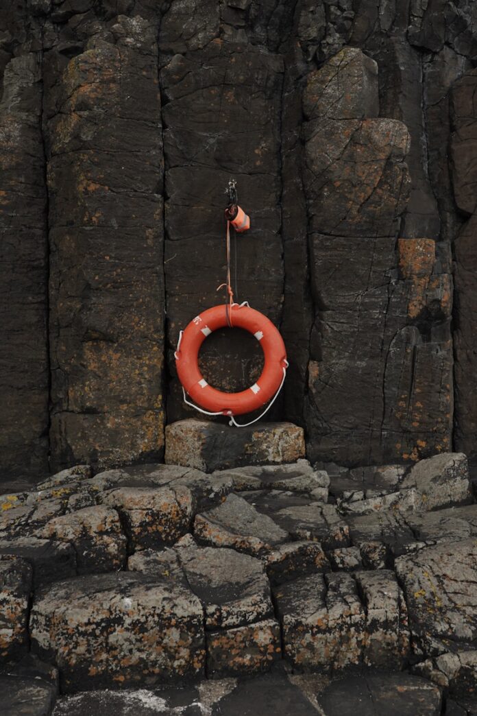 A life preserver sitting on a rock formation