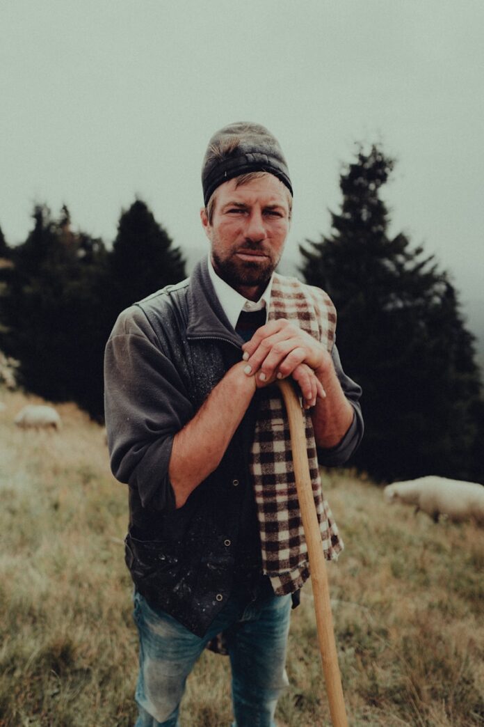 a man holding a stick