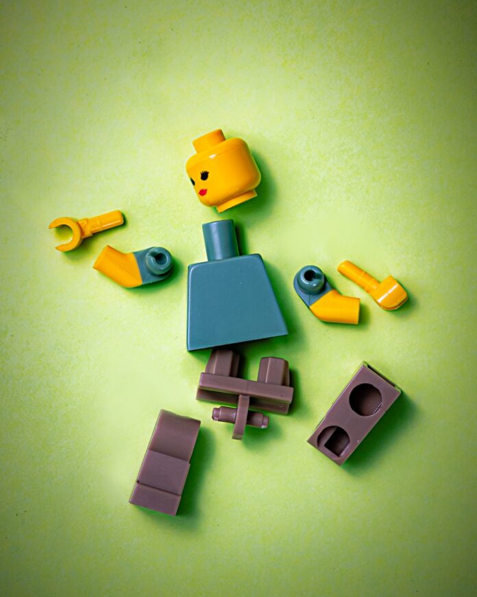 Photo by Jackson Simmer blue orange green and yellow plastic toy
