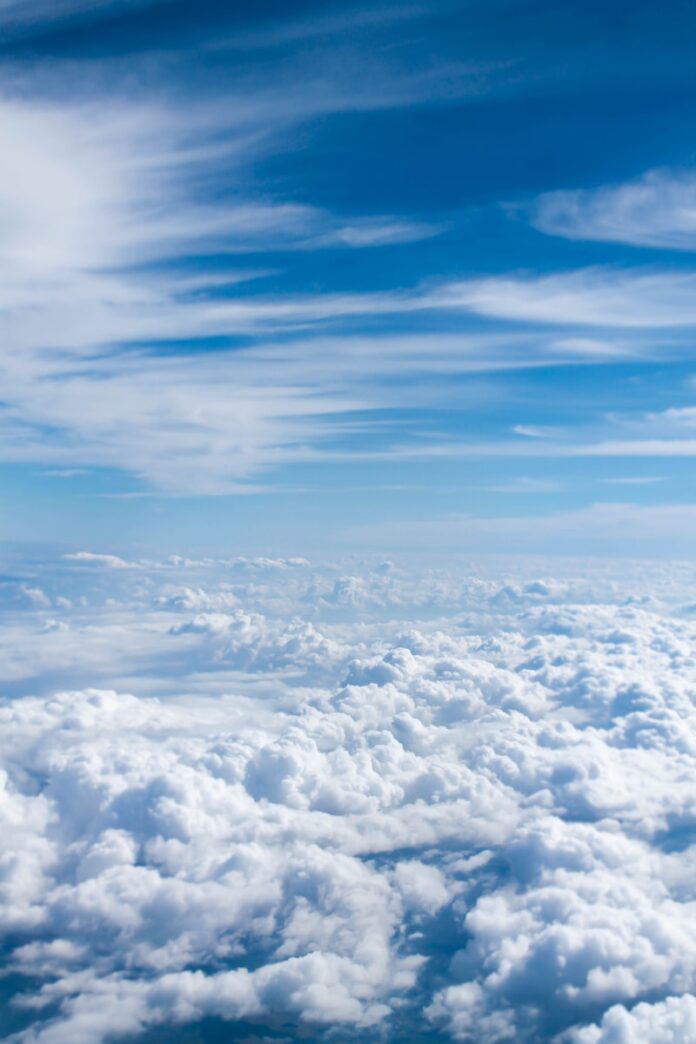 Photo by Taylor Van Riper above-cloud photo of blue skies