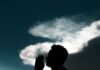 As orações que ele responde silhouette of man sitting on rock during daytime