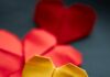 Graça nos alcança yellow and red heart shaped paper