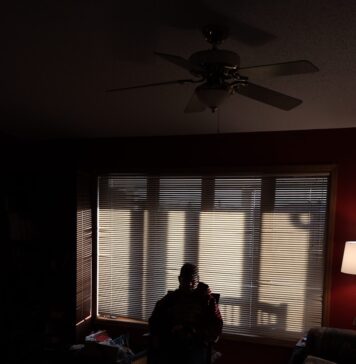 Deus tem uma resposta para a vida woman in black jacket standing near window