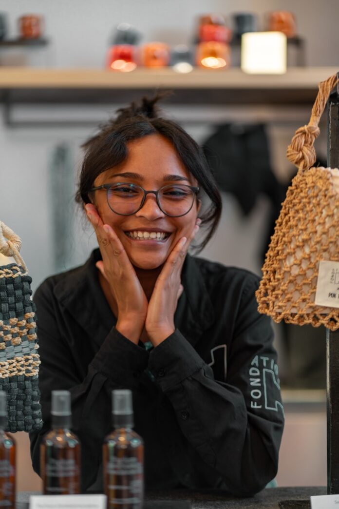 Photo by Shane Ryan Herilalaina Smiling woman with hands on her cheeks