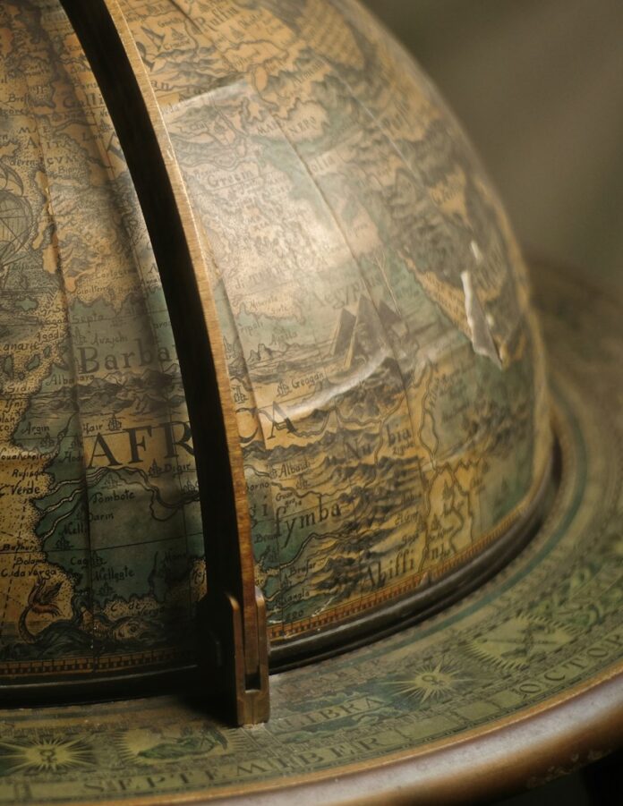 Photo by Viktor Forgacs brown terrestrial globe