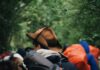 Salvação não é conquistada man carrying black sleeping bag and backpack
