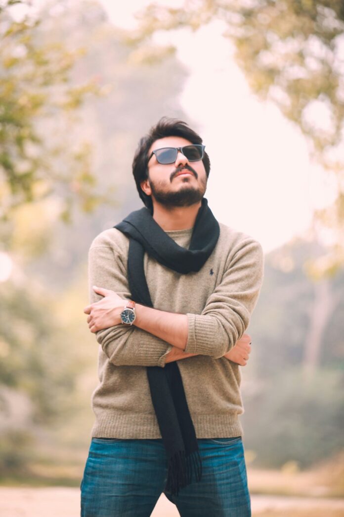 Photo by Zubair Hussain a person with the arms crossed